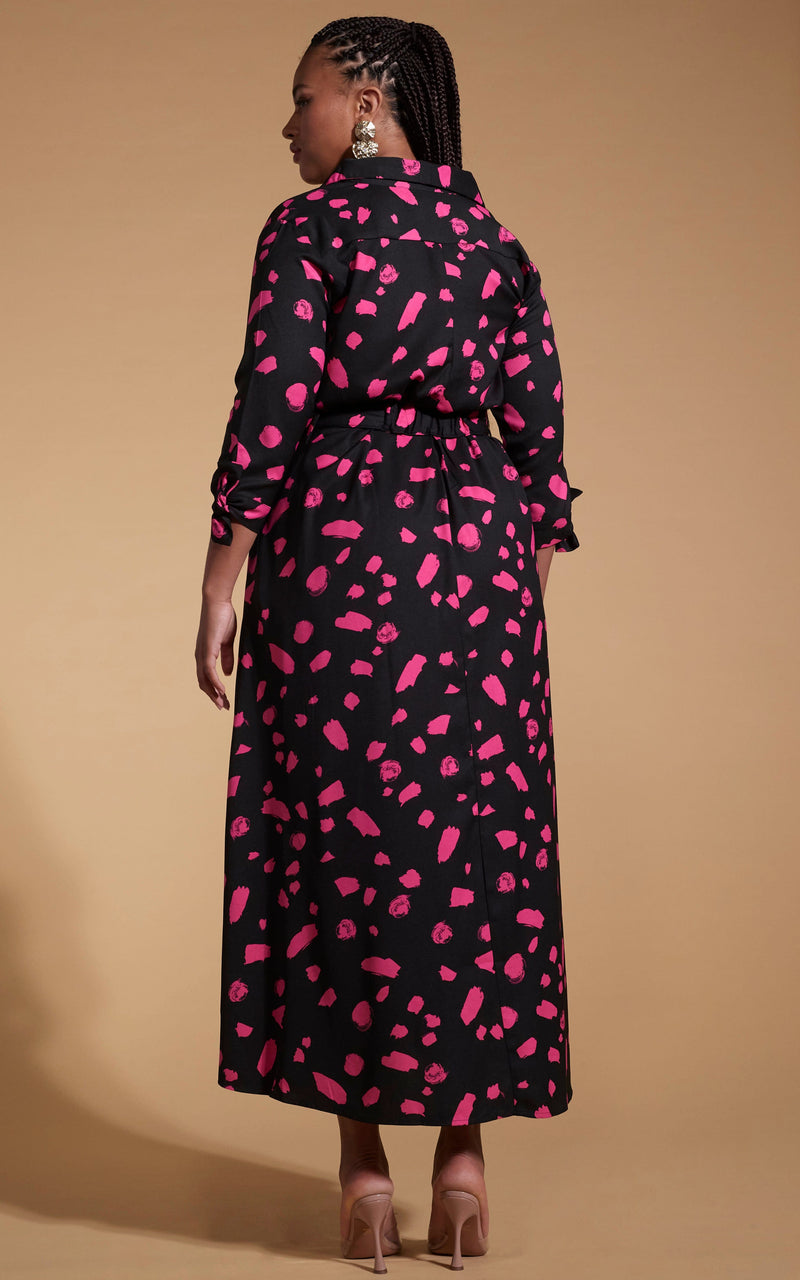 Model faces backwards wearing a pink and black Dancing Leopard print dress.
