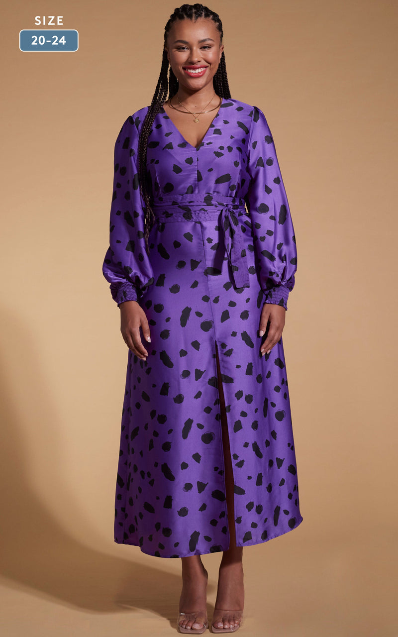 Model facing forward wearing an abstract purple Dancing Leopard dress.