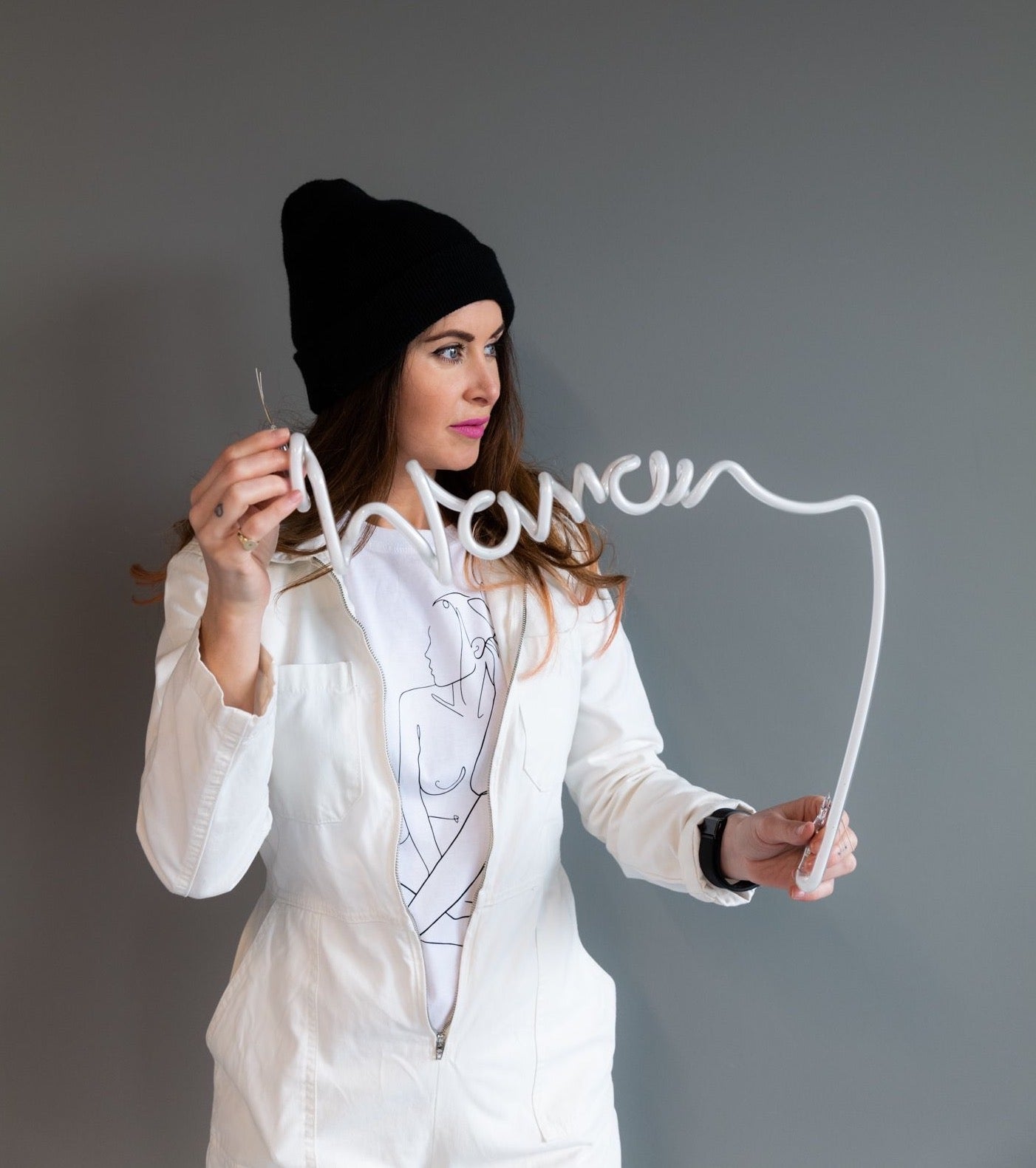 Lauren Baker holding Woman art