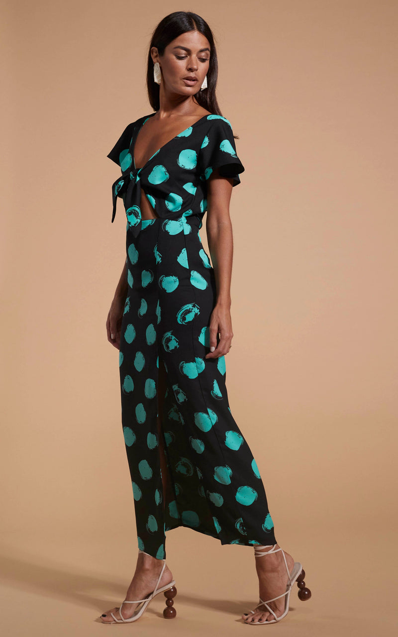 Dancing Leopard model wearing Lily Dress In Green On Black Dot facing side on