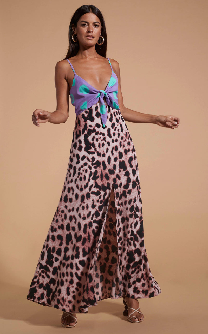 Dancing Leopard model wearing Florence Dress In Green On Purple Dot & Blush Leopard with hands posed to the side