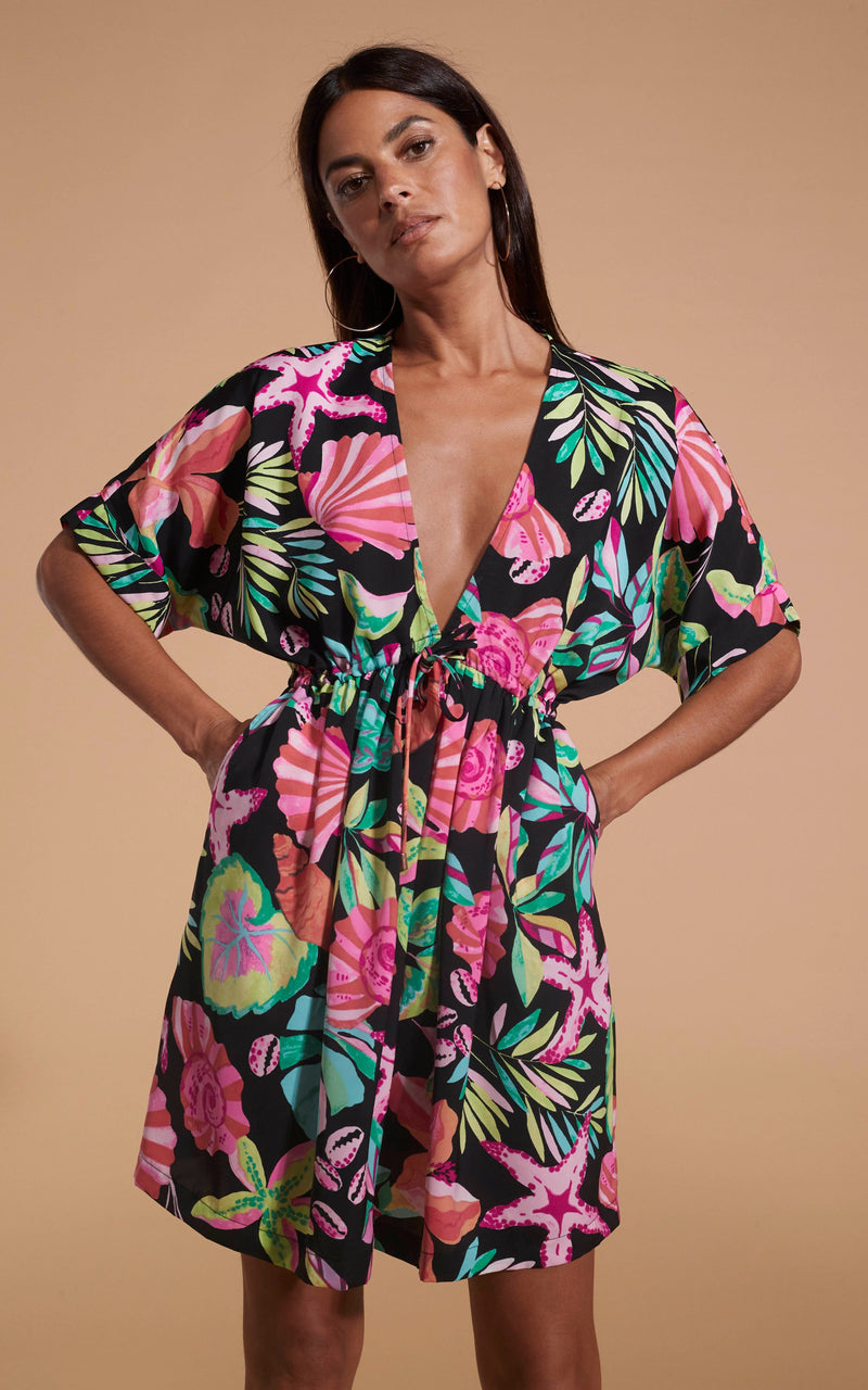 Dancing Leopard model wearing Coco Loco Dress In Starfish posed with hands in pockets