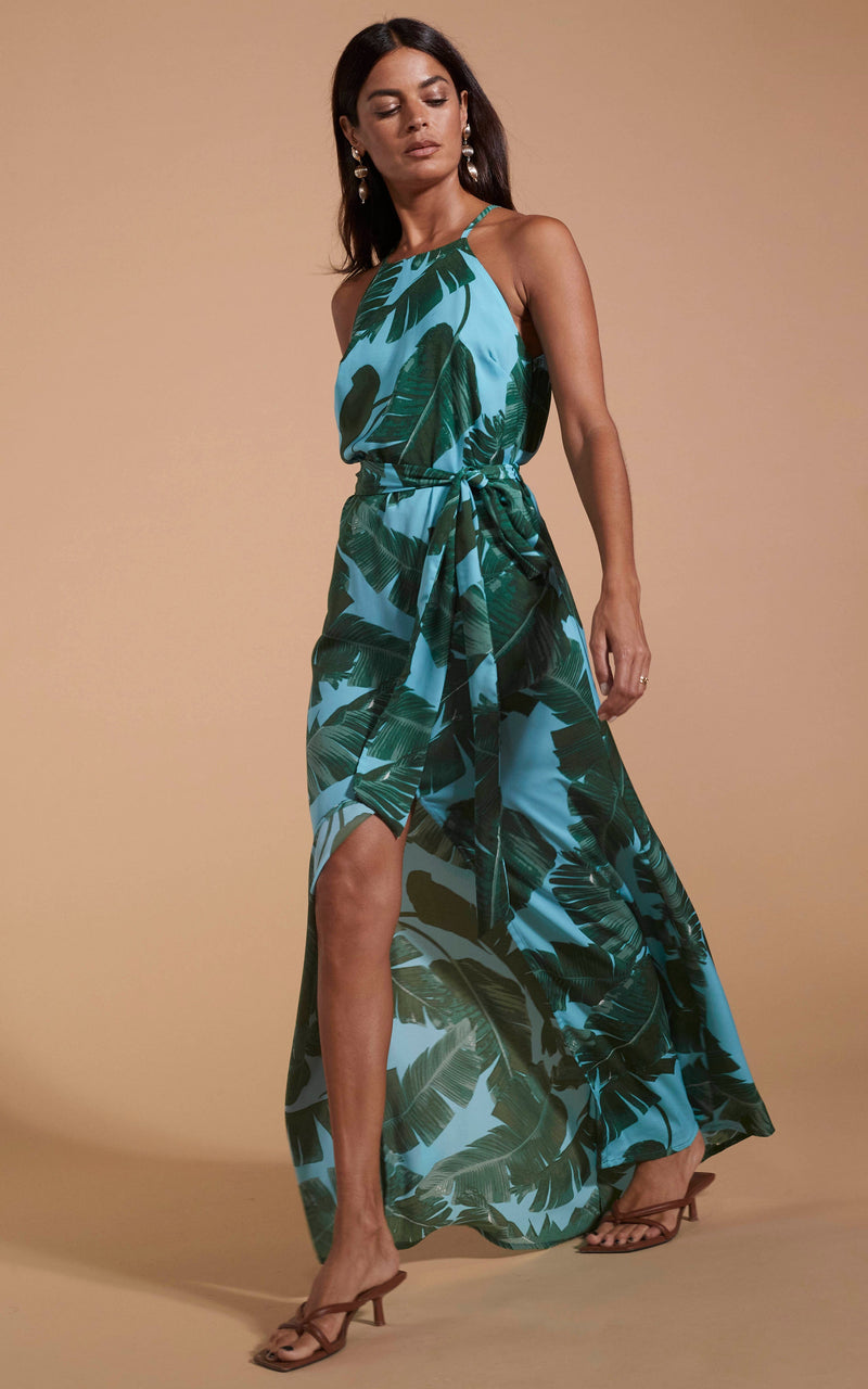 Dancing Leopard model wearing Sunset Dress In Vintage Blue Palm walking from right to left