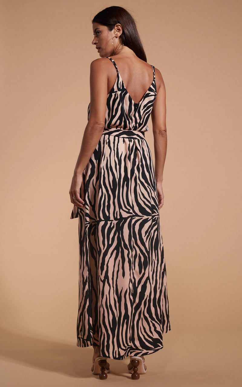 Dancing Leopard model wearing Sookie Slip Dress In Blush Zebra facing away to reveal back detail