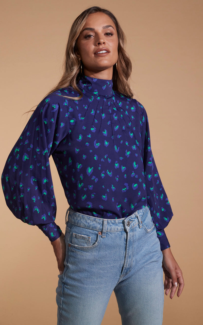 Dancing Leopard model wearing Margo Pintuck Blouse in Abstract Purple on Navy