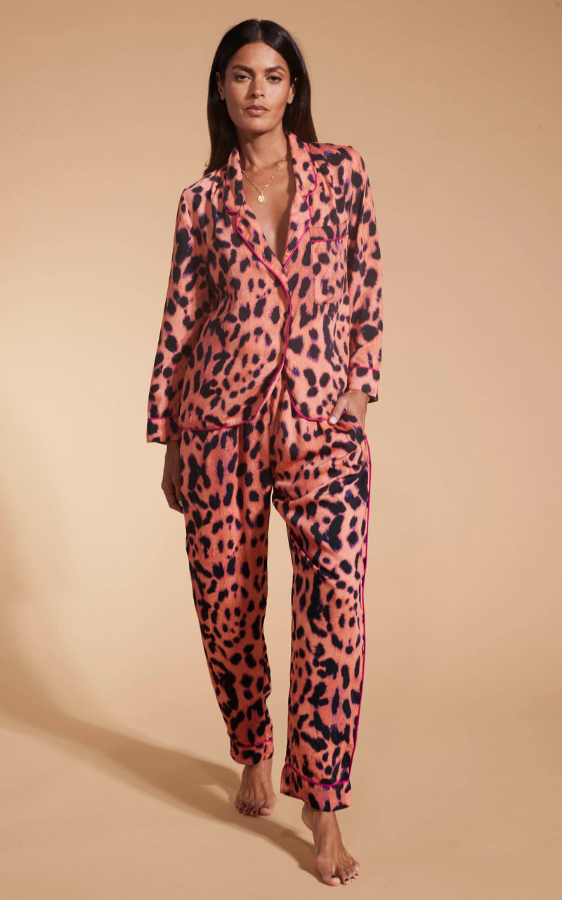 Model facing forward wearing the Dancing Leopard Plorange Leopard set pyjamas.