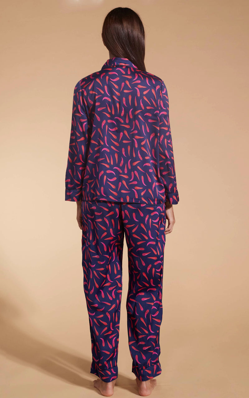 Model facing backwards wearing the Dancing Leopard Chilli Pepper set pyjamas.