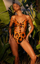 A female model faces forward. She wears a Dancing Leopard leopard print swimsuit.