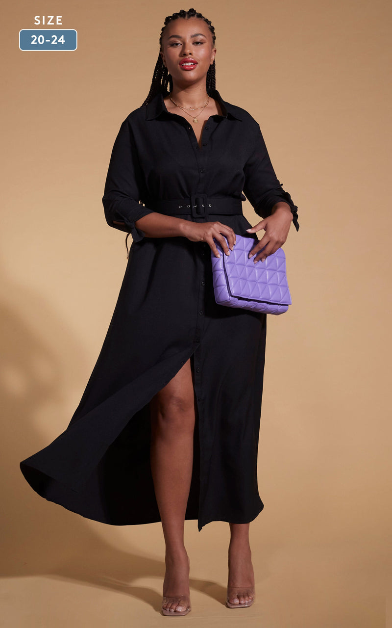Model faces forward wearing a black Dancing Leopard dress with purple bag.