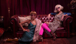 Dancing Leopard models sat on leather sofa