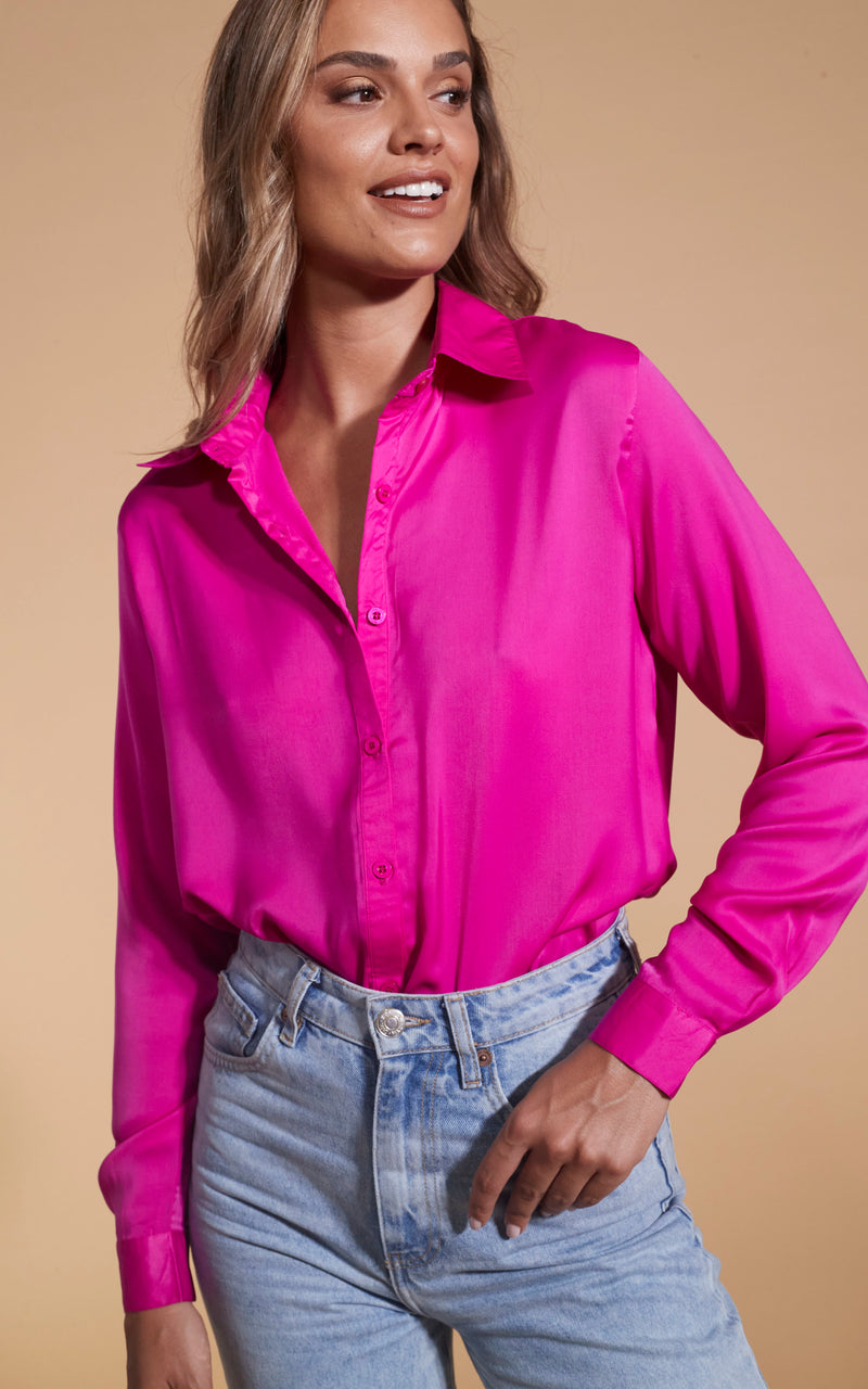 Dancing Leopard model wearing Nevada Shirt In Magenta with light blue jeans