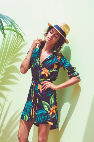 Dancing Leopard model wearing floral dress against green background