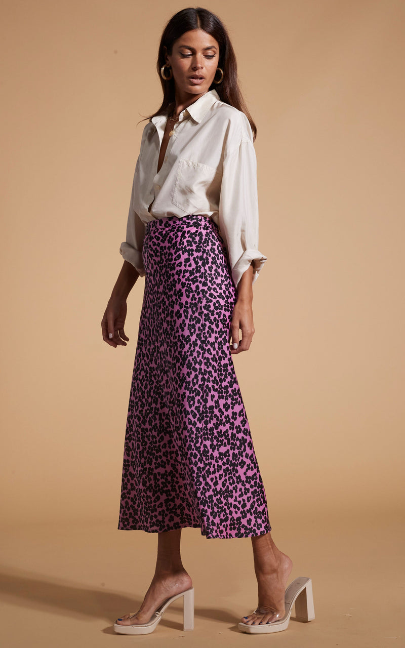 Dancing Leopard model wearing Renzo Skirt In Black On Pink Leopard facing side on