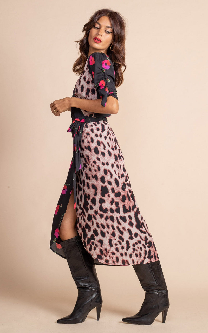 Dancing Leopard model wearing Olivera Midi Wrap Dress in Poppies on Black Mix posed looking over shoulder