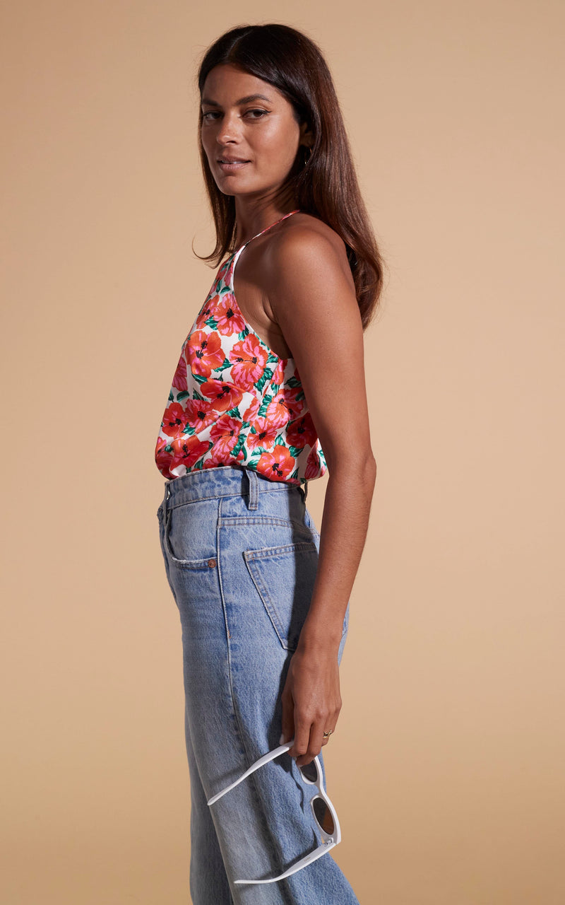 Dancing Leopard model wearing Nina Halter Cami Top In Hibiscus Red Orange On White facing side on