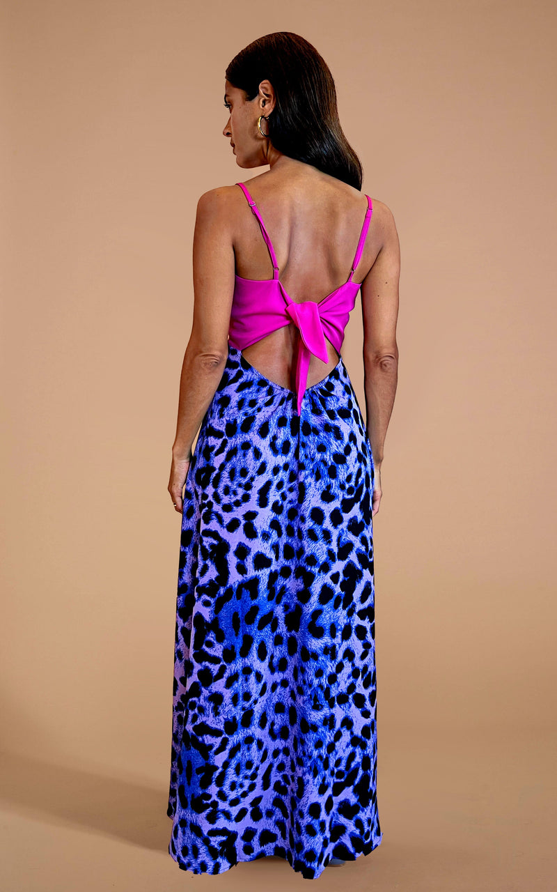 Model faces backwards wearing a leopard print pink and lilac Dancing Leopard Dress.