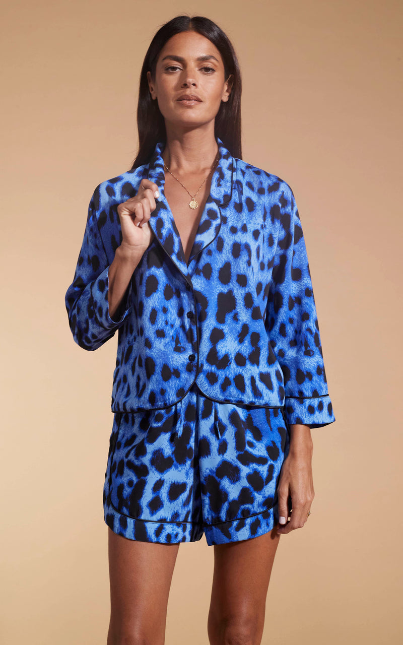 Model facing forward wearing the Oona Shortie PJ Set In Bright Blue Leopard.