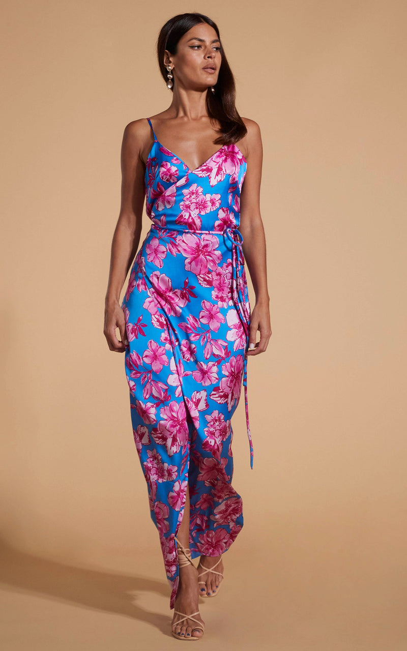 Dancing Leopard model wearing Mariah Wrap Dress In Pink & Blue Floral walking towards shot