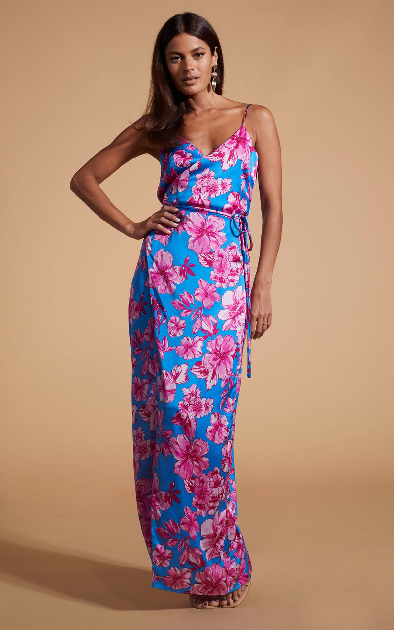 Dancing Leopard model wearing Mariah Wrap Dress In Pink & Blue Floral posed with one hand on hip