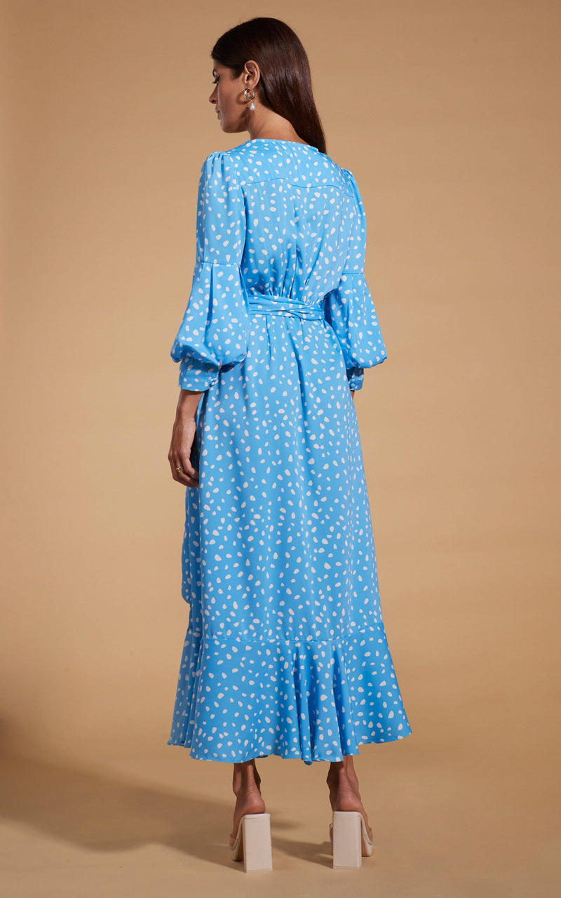 Dancing Leopard model wearing Havannah Maxi Wrap Dress in Abstract White on Blue facing away to show back of dress