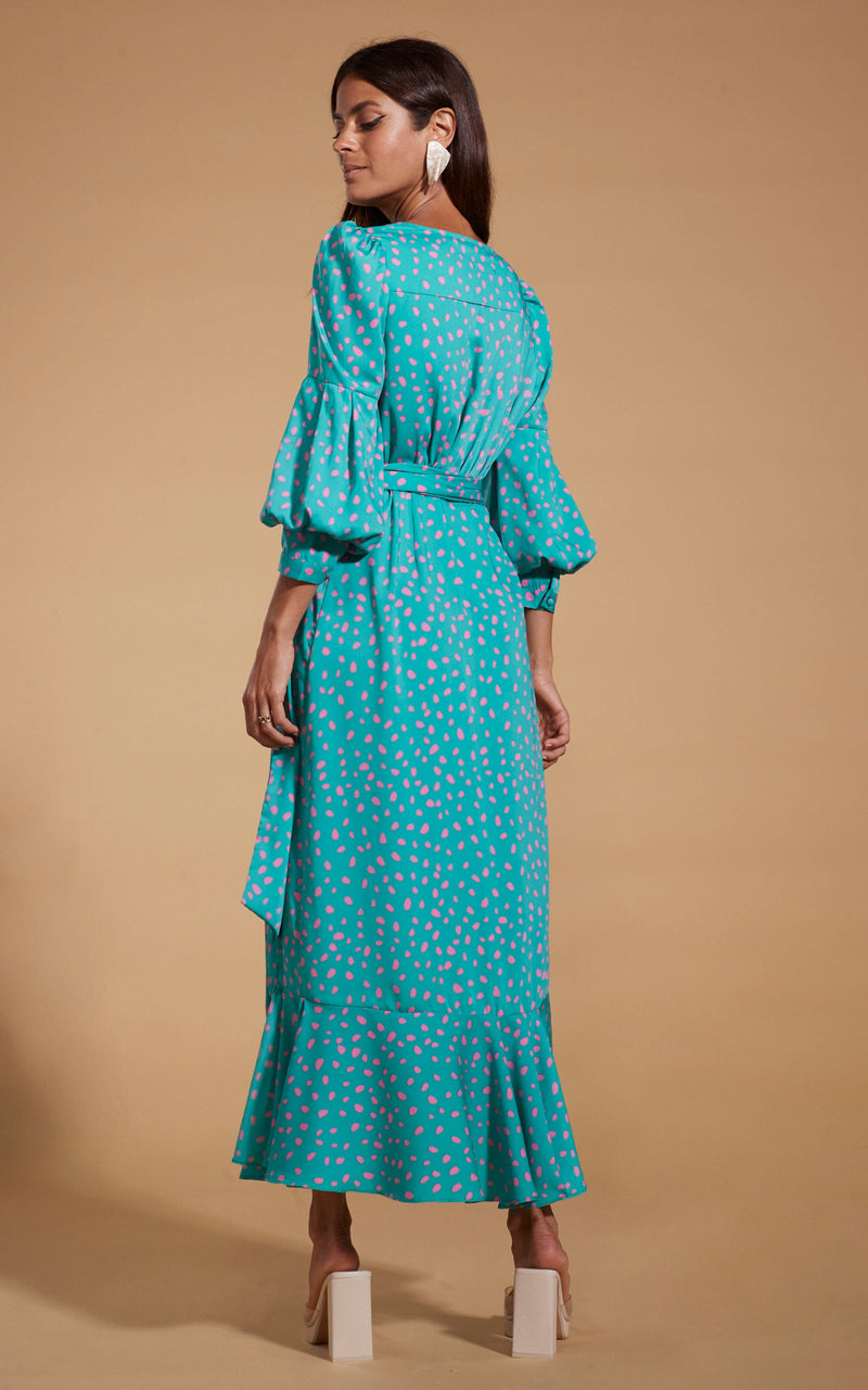 Dancing Leopard model wearing Havannah Maxi Wrap Dress in Abstract Pink on Sea Green facing away to show back of dress