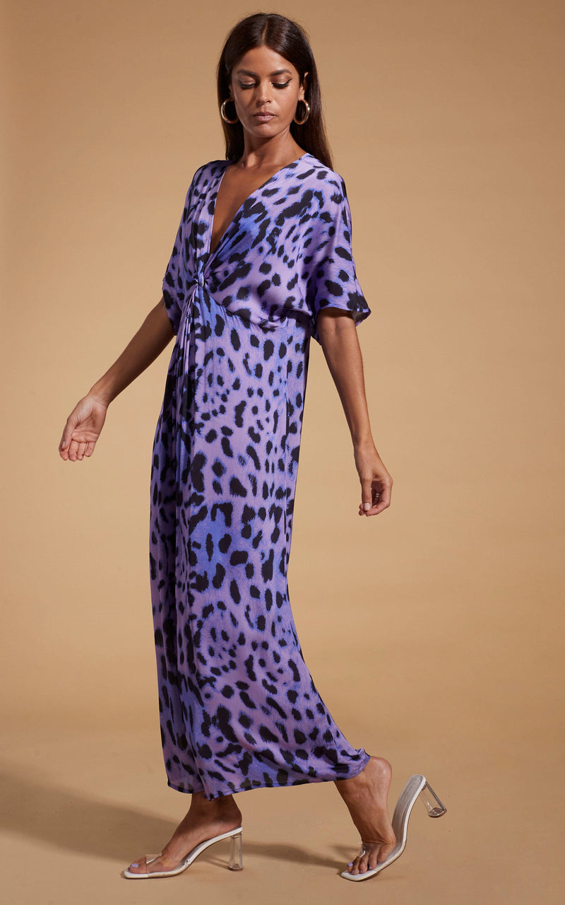 Dancing Leopard model wearing Makuna Kaftan In Lilac Leopard facing side on