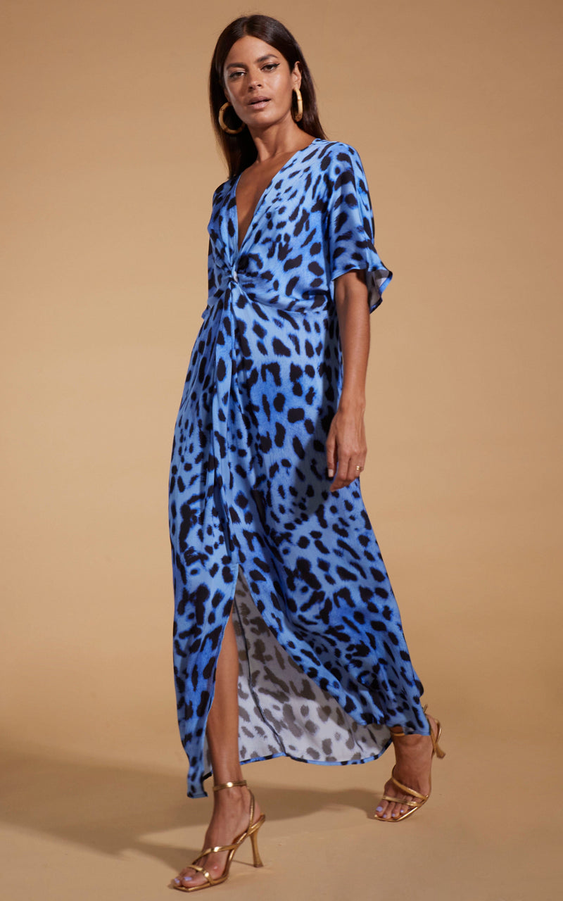 Dancing Leopard model wearing Makuna Kaftan In Bright Blue Leopard walking from right to left