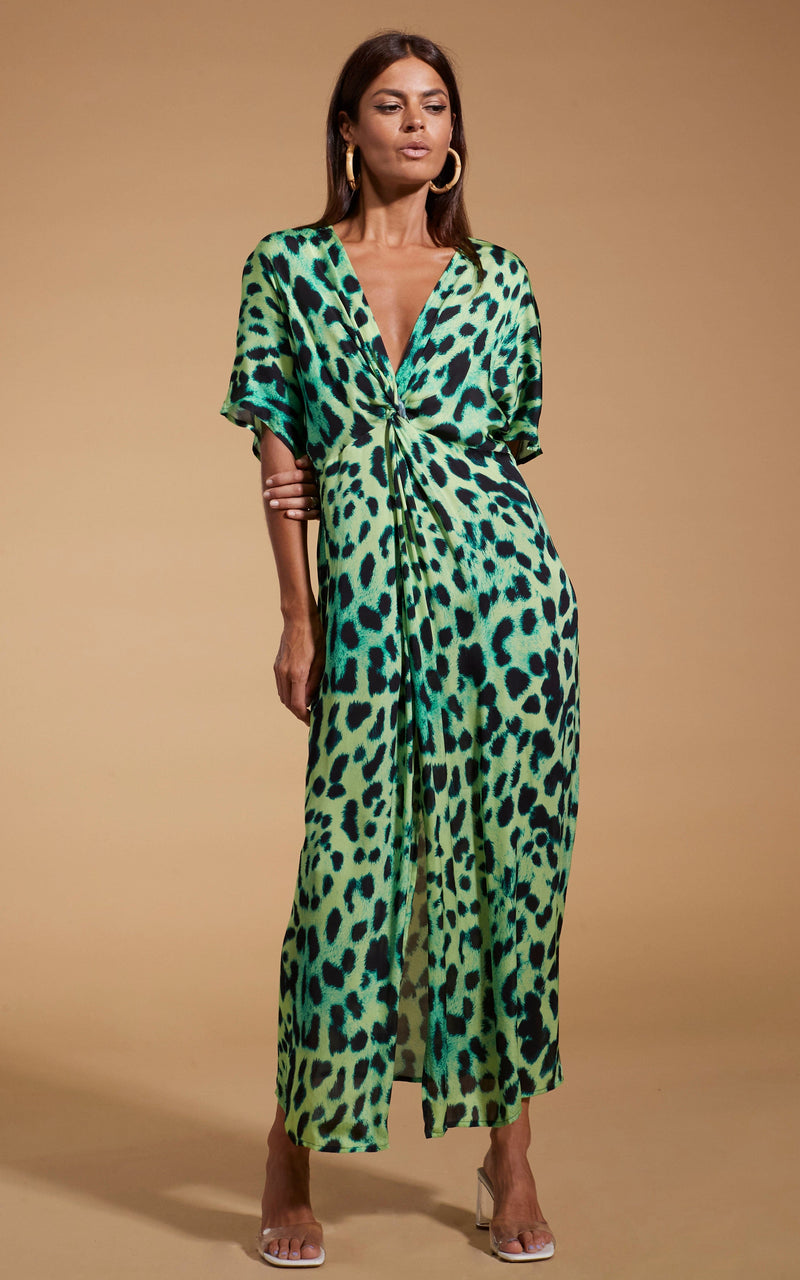 Dancing Leopard model wearing Makuna Kaftan In Lime Leopard posed holding her arm