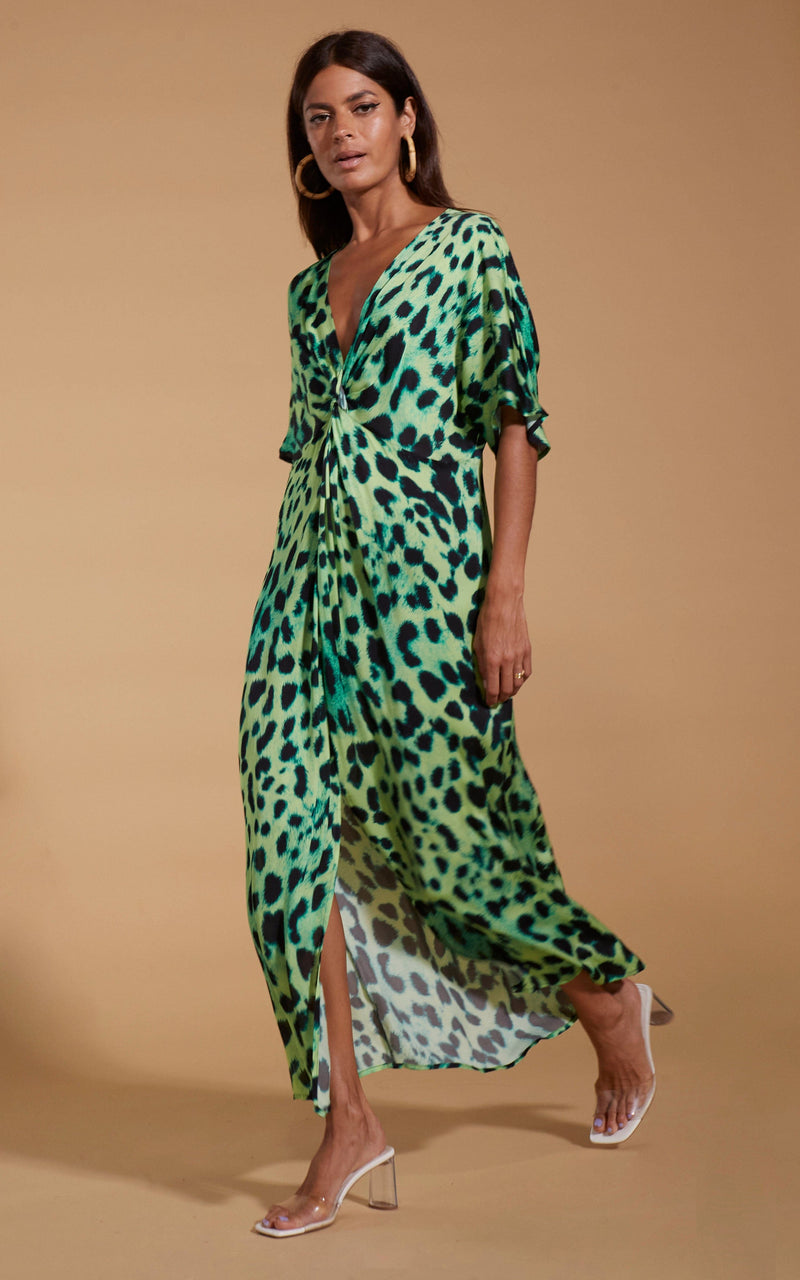 Dancing Leopard model wearing Makuna Kaftan In Lime Leopard walking from right to left