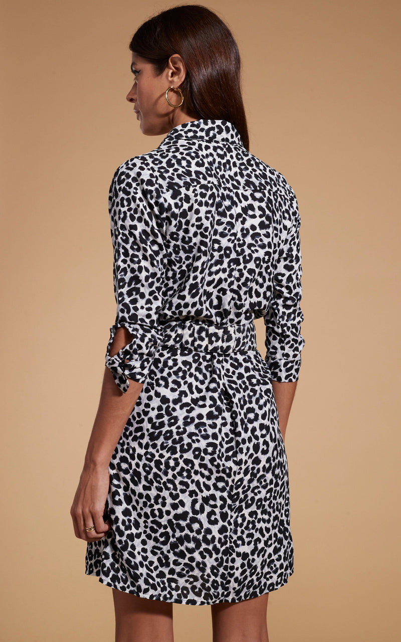 Dancing Leopard model wearing Jonah Mini Shirt Dress in Mono Leopard facing away to show back of dress