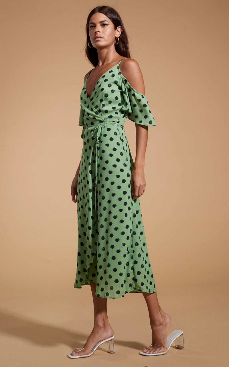 Dancing Leopard model wearing Ivy Dress Green Polka Dot stood side on