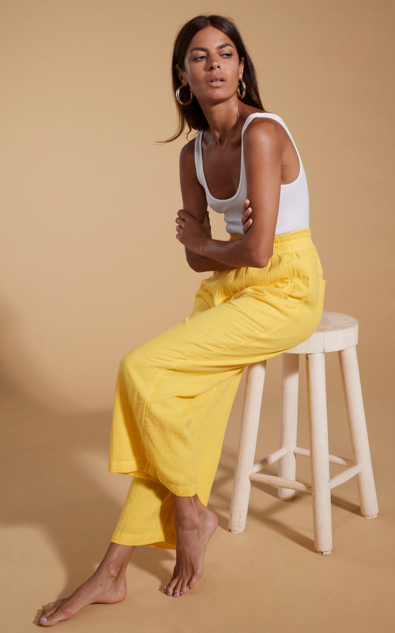 Pale yellow trousers sales