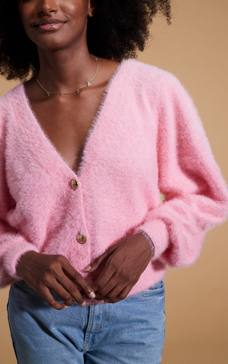 close up of Dancing Leopard model wearing Bambino Cardigan in Candy Pink