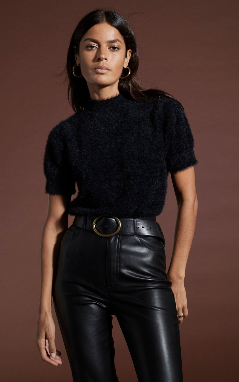 Dancing Leopard model wearing Millie Cropped Knit Top in Black with leather look trousers