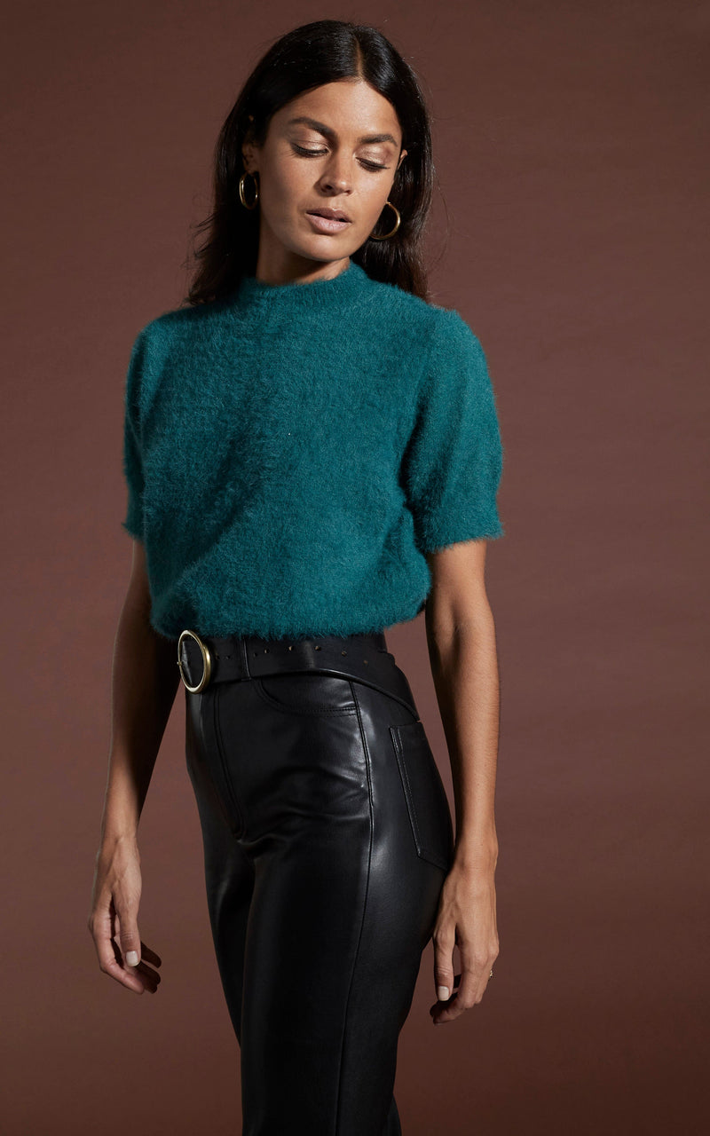 Dancing Leopard model wearing Millie Cropped Knit Top in Forest Green facing side on