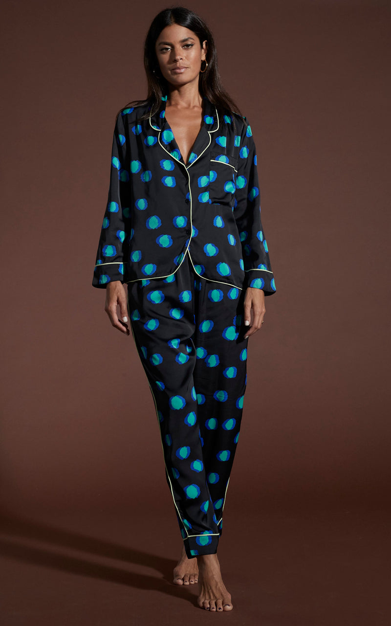 Dancing Leopard model wearing Cosmos Satin Long Leg PJ Set in Polka Dot Blue on Black