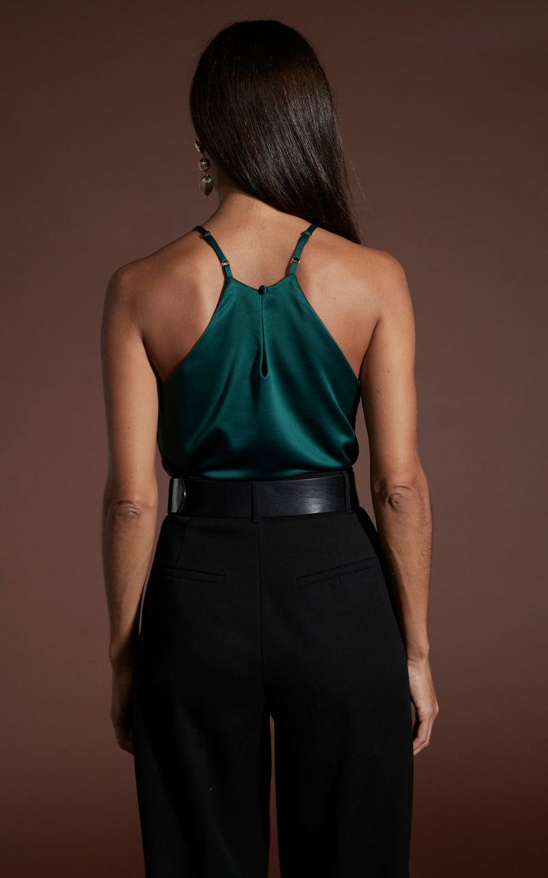 Dancing Leopard model wearing Nina Halter Cami Top In Pine Green facing away to show back of top