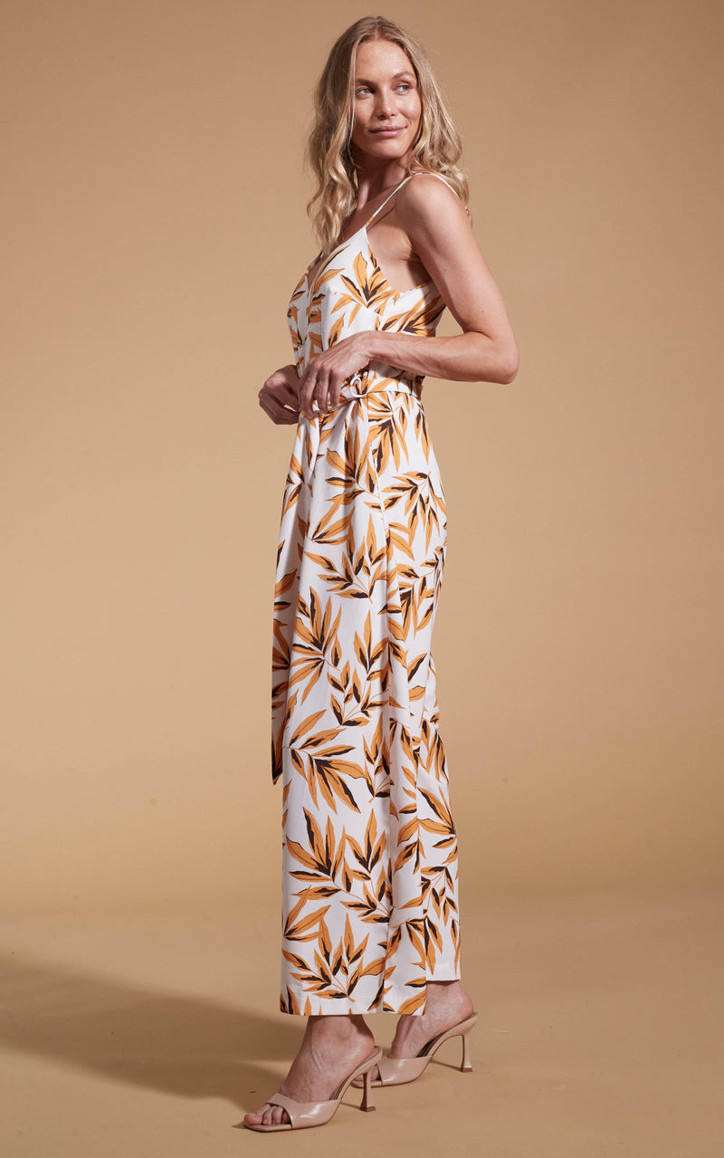 Dancing Leopard model wearing Gabriella Jumpsuit in Tropic Natural posed facing side on