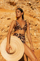 Dancing Leopard model faces forwards wearing Tamika Bikini Top and Juniper Bikini Bottoms and straw hat