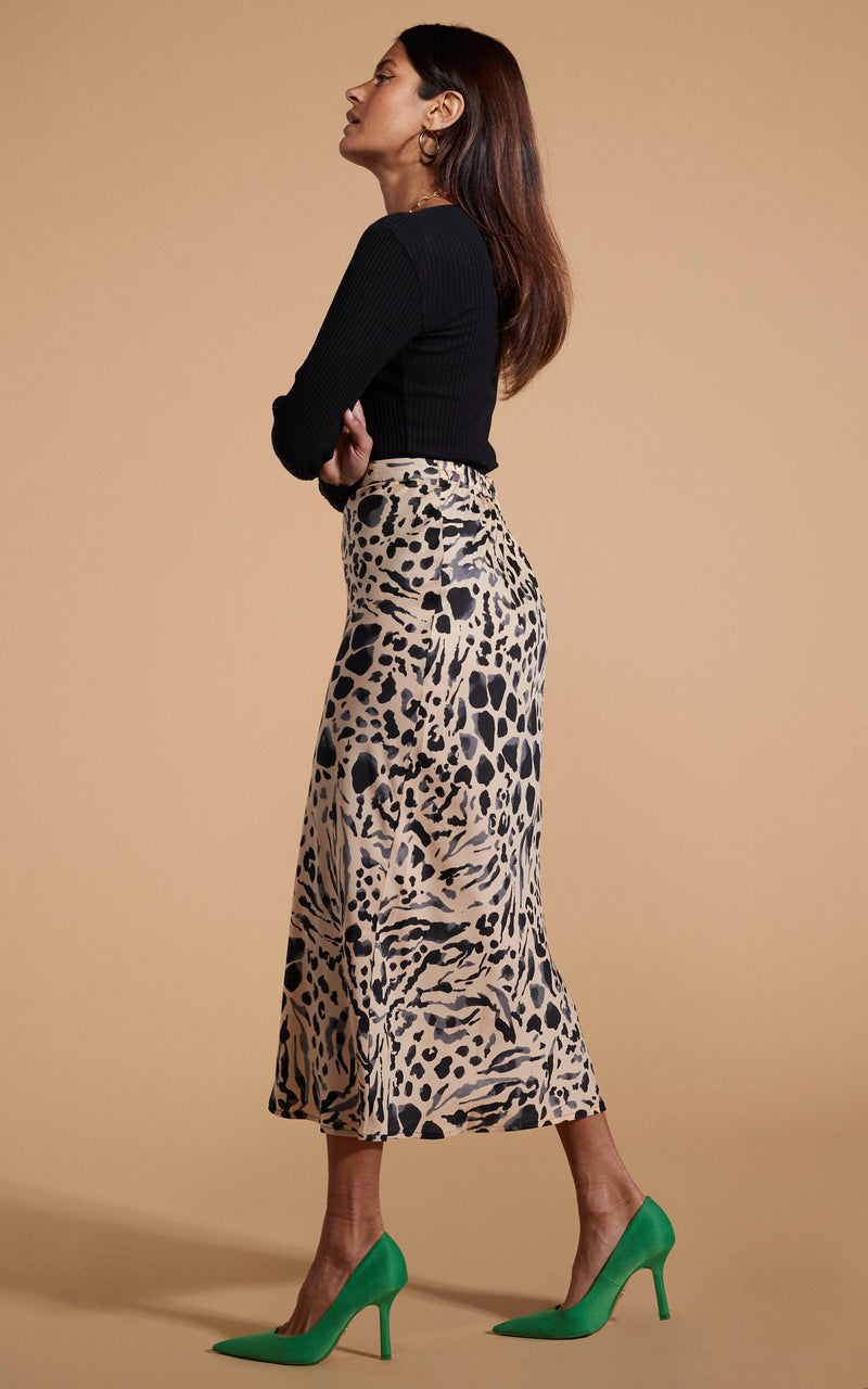 Dancing Leopard model wearing Renzo Skirt In Smudge Leopard facing side on