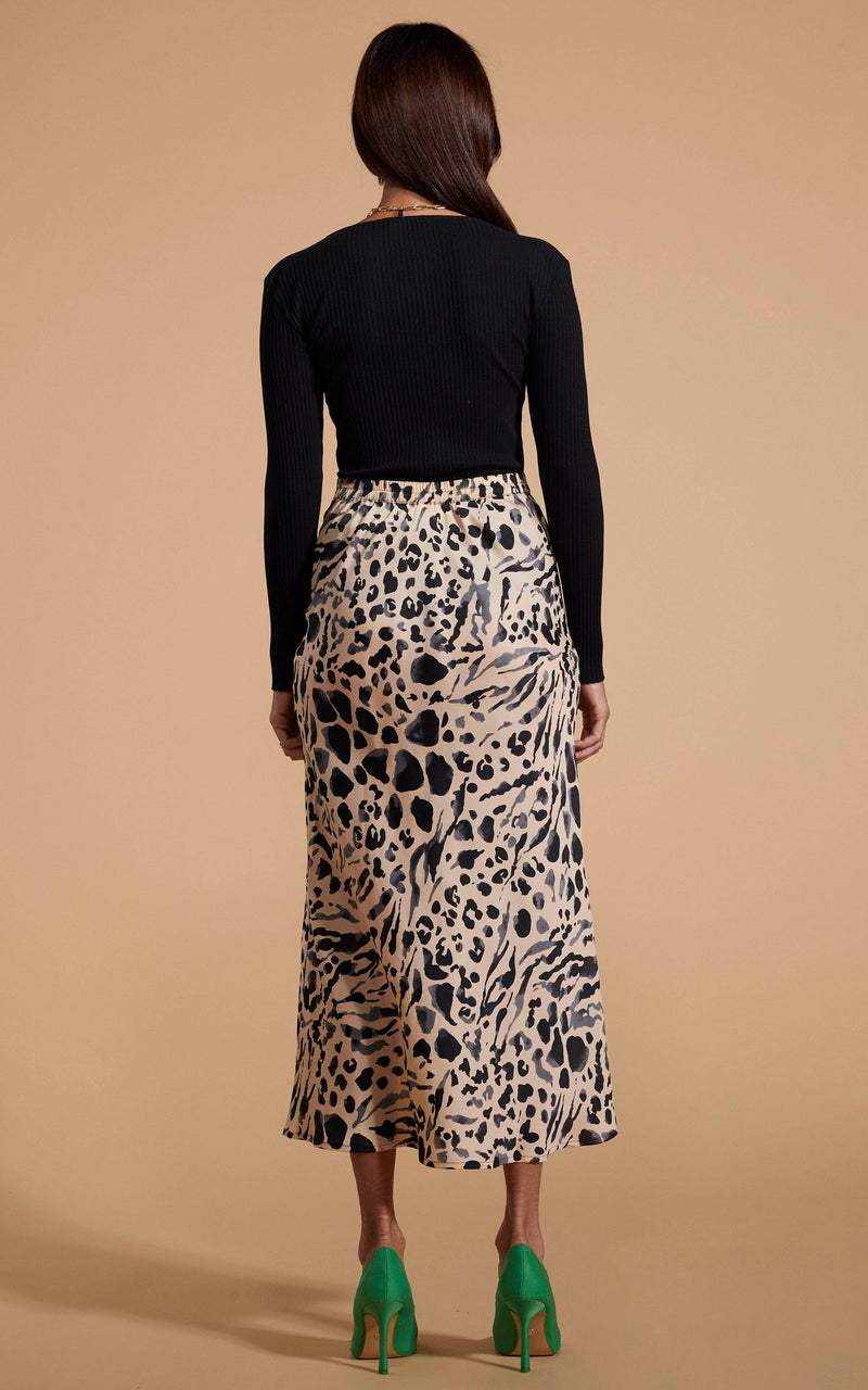 Dancing Leopard model wearing Renzo Skirt In Smudge Leopard facing away to show back of skirt