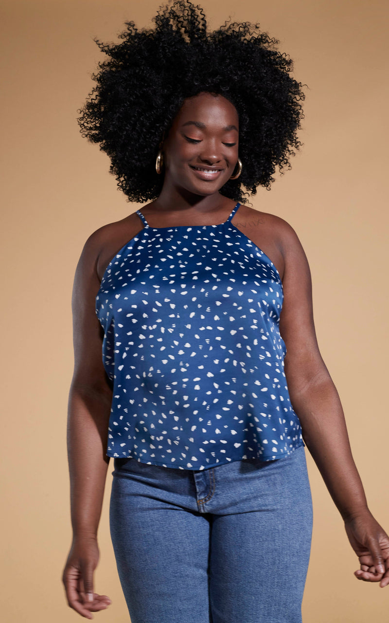 Dancing Leopard model wearing blue denim jeans and the Nina halter cami top in abstract wihite on navy
