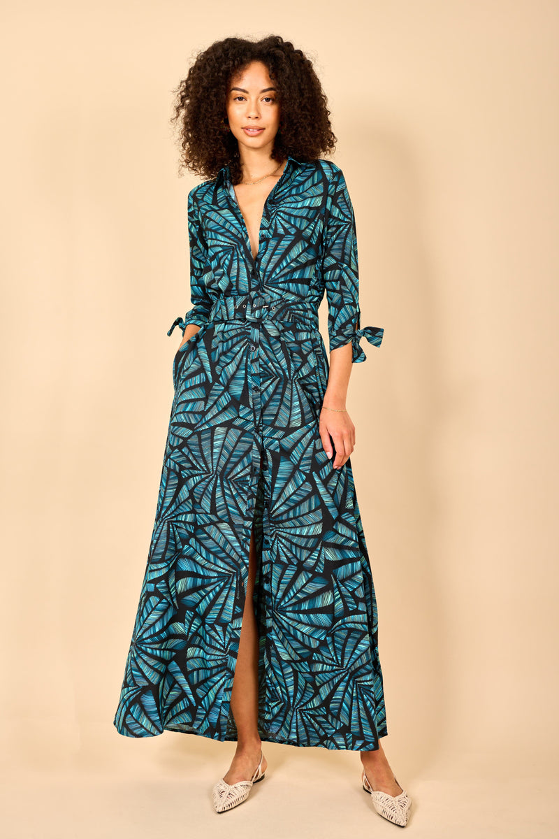 Dancing Leopard model wearing Dove Dress in Fan Turquoise on Black posed with hand in pocket