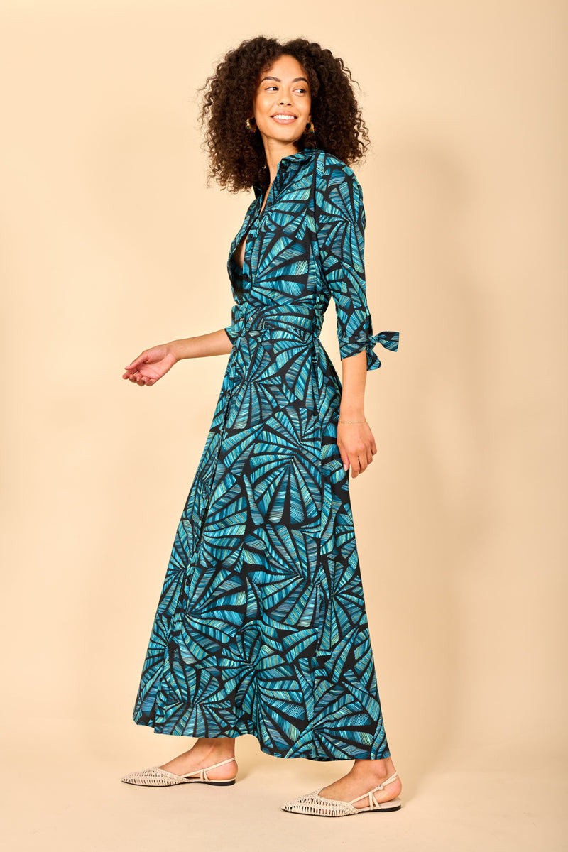 Dancing Leopard model wearing Dove Dress in Fan Turquoise on Black walking from right to left