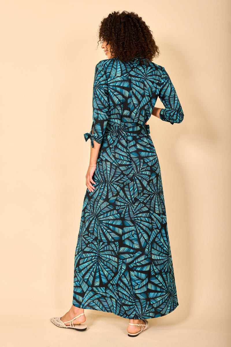 Dancing Leopard model wearing Dove Dress in Fan Turquoise on Black facing away to reveal back details