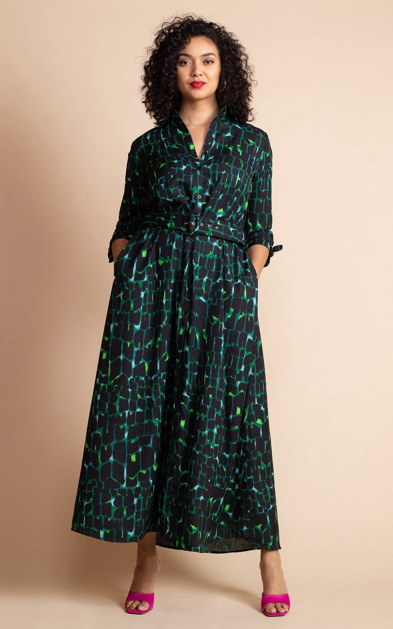Dancing Leopard model standing with hands in pockets forward wearing Dove Dress in Green alligator