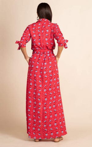 Dancing Leopard model wearing Dove Dress in Red Daisy facing away to reveal back of dress