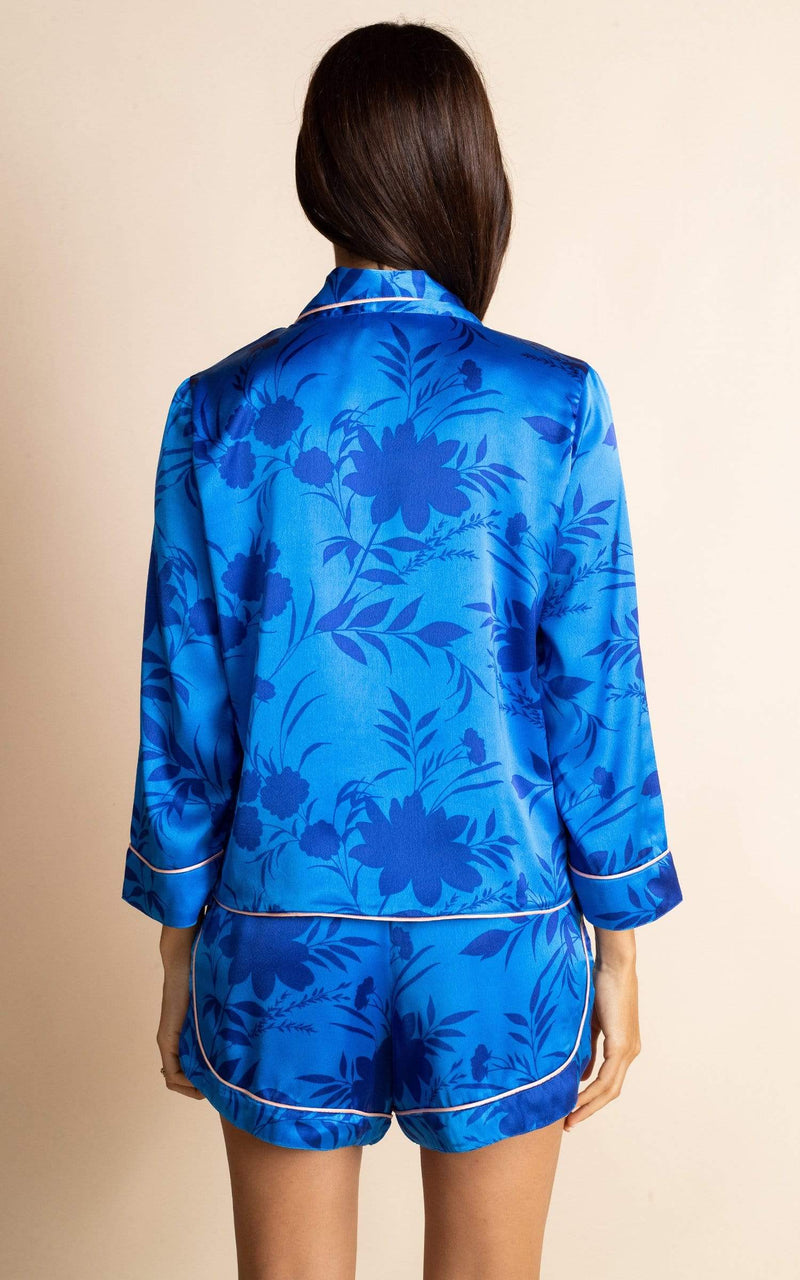 Dancing Leopard model wearing Oona Shortie PJ Set in Silhouette Light Blue facing away to show back of pyajamas