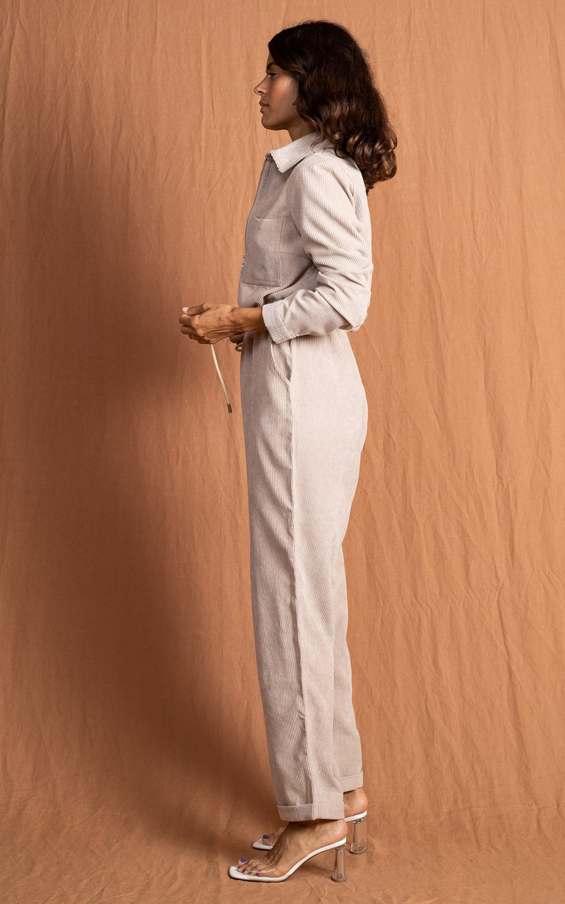 Dancing Leopard model wearing Blaze Boilersuit in Sand facing side on