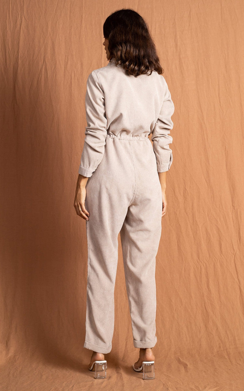 Dancing Leopard model wearing Blaze Boilersuit in Sand facing away